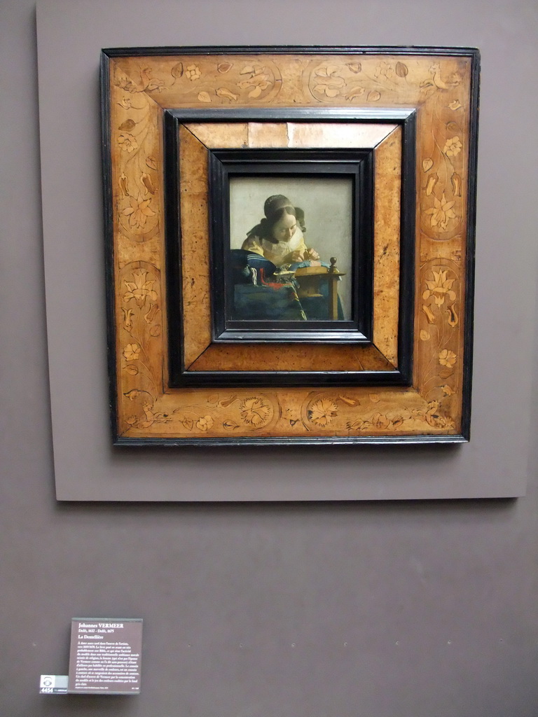 Painting `De Kantwerkster` by Johannes Vermeer, on the Second Floor of the Richelieu Wing of the Louvre Museum