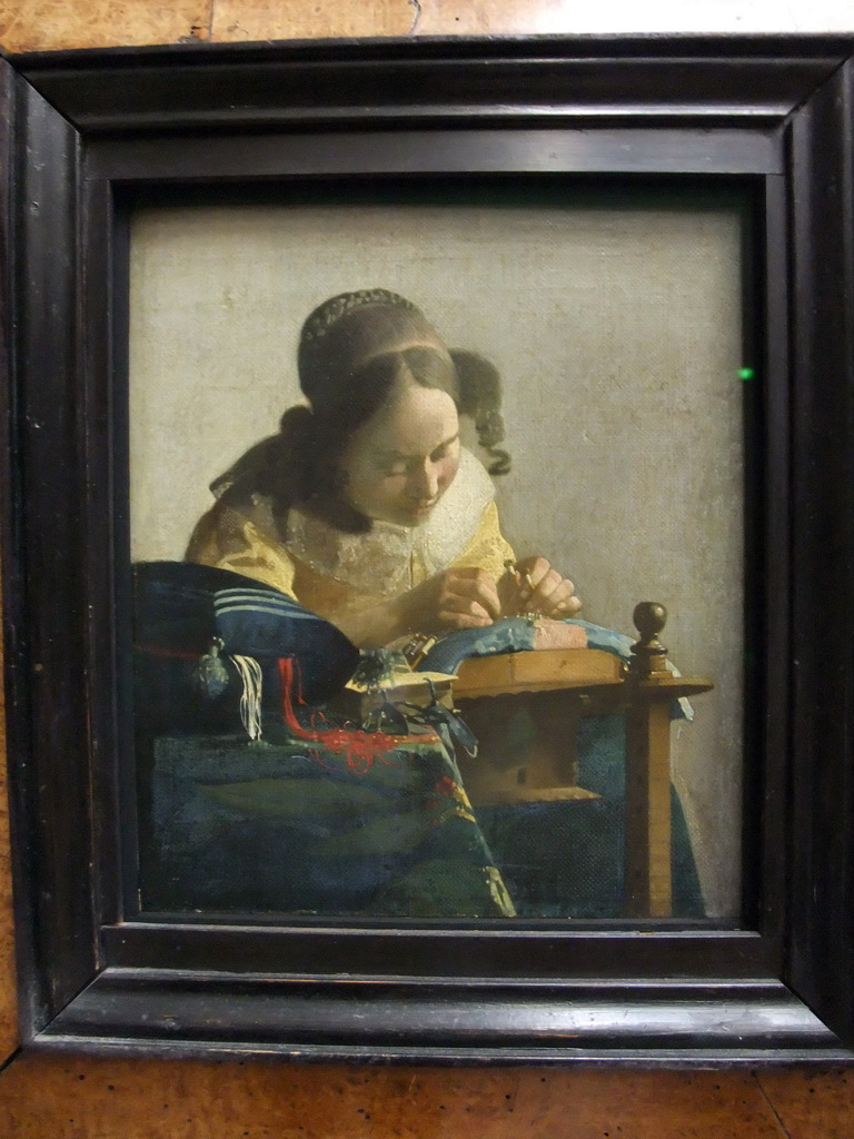 Painting `De Kantwerkster` by Johannes Vermeer, on the Second Floor of the Richelieu Wing of the Louvre Museum