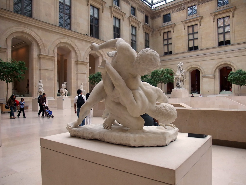 Sculpture `Uffizi Wrestlers` by Philippe Magnier, in the Hall with 18th-19th century French sculptures, on the Ground Floor of the Richelieu Wing of the Louvre Museum