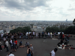 Street vendors on top of the Montmartre hill, with a view on the Montmartre staircase and the region to the south