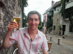 Tim with beer on the terrace of the restaurant `La Maison Rose` in the Rue de l`Abreuvoir street on the Montmartre hill