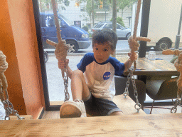 Max on a swing at the Le Baoma restaurant