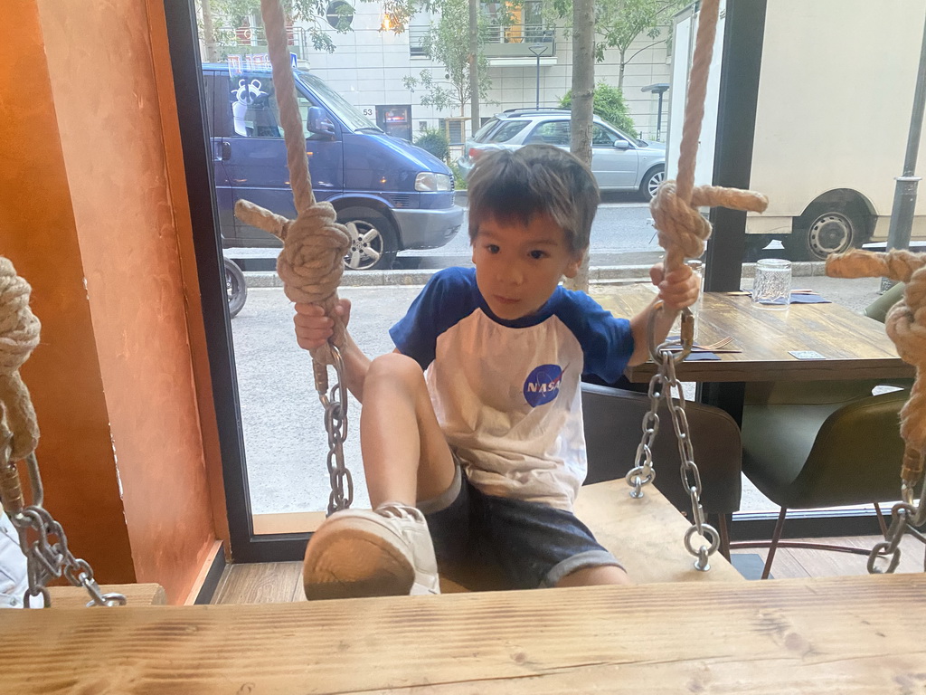 Max on a swing at the Le Baoma restaurant