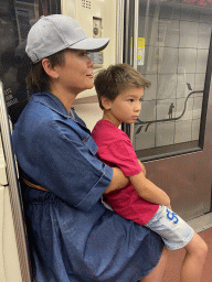 Miaomiao and Max at the subway from the La Défense railway station to the city center