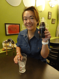 Miaomiao with a Coca-Cola at the L`Emeraude Atelier Beyrouth restaurant
