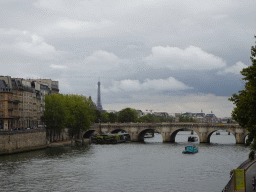 The Pont Neuf bridge over the Seine river, the Institut de France building and the Eiffel Tower, viewed from the Pont au Change bridge