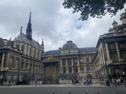 Entrance gate and front of the Palais de Justice de Paris courthouse and the Sainte-Chapelle chapel at the Boulevard du Palais