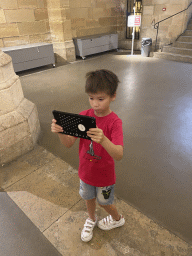 Max with an iPad at the Hall of the Men-at-arms at the Conciergerie building