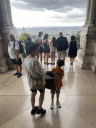 Miaomiao and Max at the entrance of the Basilique du Sacré-Coeur church, with a view on the city center