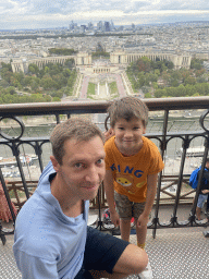 Tim and Max at the Second Floor of the Eiffel Tower, with a view on the Pont d`Iéna bridge over the Seine river, the Jardins du Trocadéro gardens, the Palais de Chaillot palace, the Bois de Boulogne park with the Louis Vuitton Foundation museum and the La Défense district with the Grande Arche de la Défense building