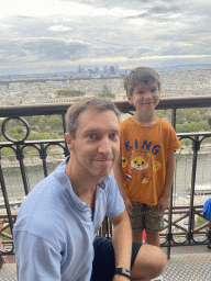 Tim and Max at the Second Floor of the Eiffel Tower, with a view on the Seine river, the Jardins du Trocadéro gardens, the Palais de Chaillot palace, the Bois de Boulogne park with the Louis Vuitton Foundation museum and the La Défense district with the Grande Arche de la Défense building