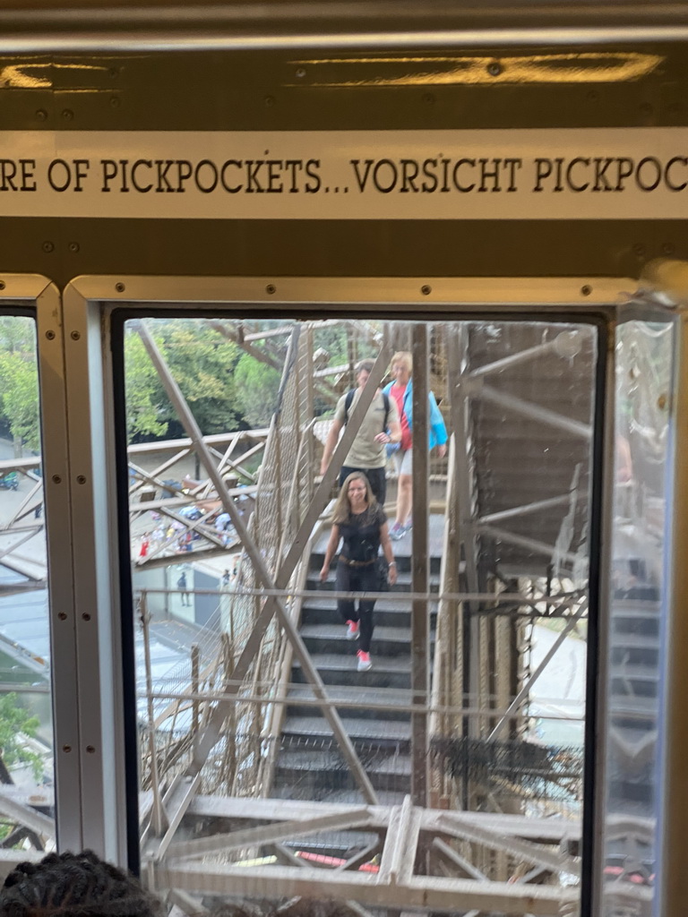 People on the staircase from the Second Floor to the Ground Floor of the Eiffel Tower, viewed from the elevator