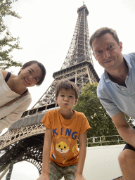 Tim, Miaomiao and Max at the Jardin de la Tour Eiffel garden, with a view on the northeast side of the Eiffel Tower