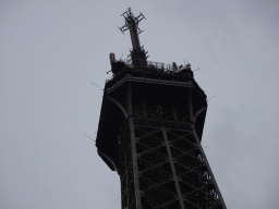 The northeast side of the top of the Eiffel Tower, viewed from the Jardin de la Tour Eiffel garden