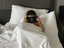 Max playing on the Nintendo Switch in our room at the Pullman Paris La Défense hotel