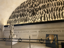 Statue, shield and laurel wreaths at the museum inside the Arc de Triomphe