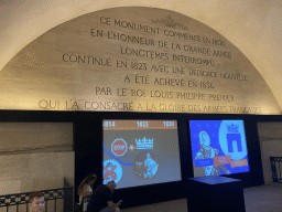Screens with information on the Arc de Triomphe at the museum inside the Arc de Triomphe