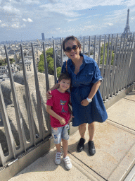 Miaomiao and Max on the roof of the Arc de Triomphe, with a view on the Tour Montparnasse tower and the Eiffel Tower