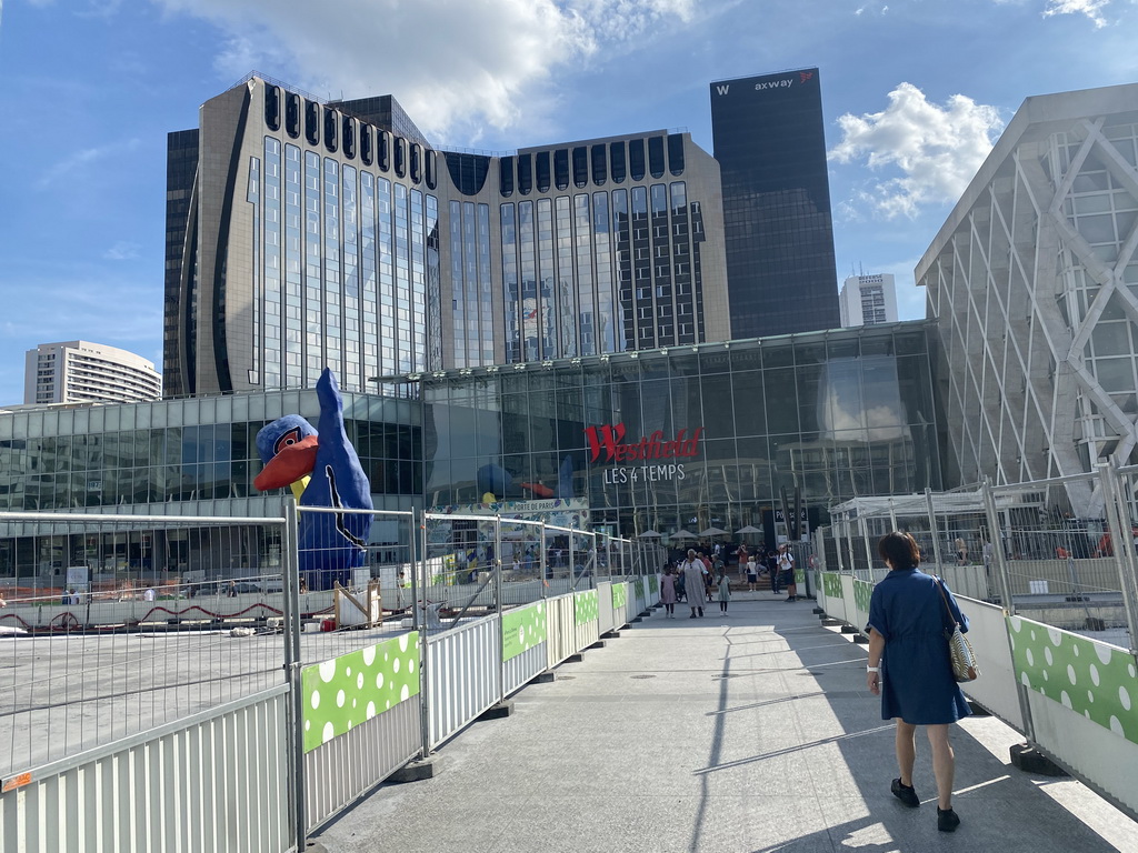 Miaomiao in front of the Westfield Les 4 Temps shopping mall at the Parvis de la Défense square