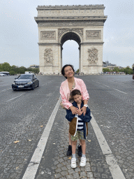 Miaomiao and Max at the Avenue des Champs-Élysées, with a view on the east side of the Arc the Triomphe at the Place Charles de Gaulle square