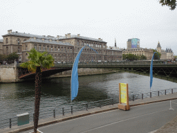 The Pont d`Arcole bridge over the Seine river and the Hôtel Dieu Hospital, viewed from the Quai de l`Hôtel de ville street