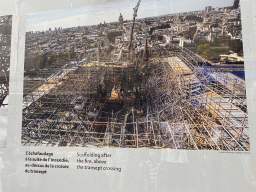 Photograph `Scaffolding after the fire, above the transept crossing` at the exhibition `Notre-Dame de Paris - The first months of a renaissance` at the Rue du Cloître-Notre-Dame street, with explanation
