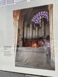 Photograph `The intact Grand Organ with the celebrated West Rose Window behind` at the exhibition `Notre-Dame de Paris - The first months of a renaissance` at the Rue du Cloître-Notre-Dame street, with explanation