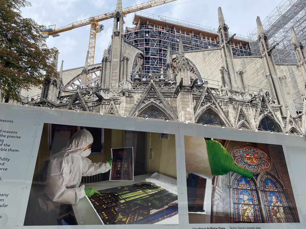 Photographs of the renovation of the Cathedral Notre Dame de Paris at the exhibition `Notre-Dame de Paris - The first months of a renaissance` and the east facade of the Cathedral Notre Dame de Paris at the Rue du Cloître-Notre-Dame street