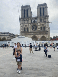 Miaomiao and Max in front of the Cathedral Notre Dame de Paris, under renovation, at the Parvis Notre Dame - Place Jean-Paul II square