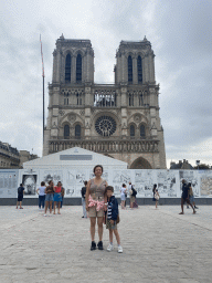 Miaomiao and Max in front of the Cathedral Notre Dame de Paris, under renovation, at the Parvis Notre Dame - Place Jean-Paul II square