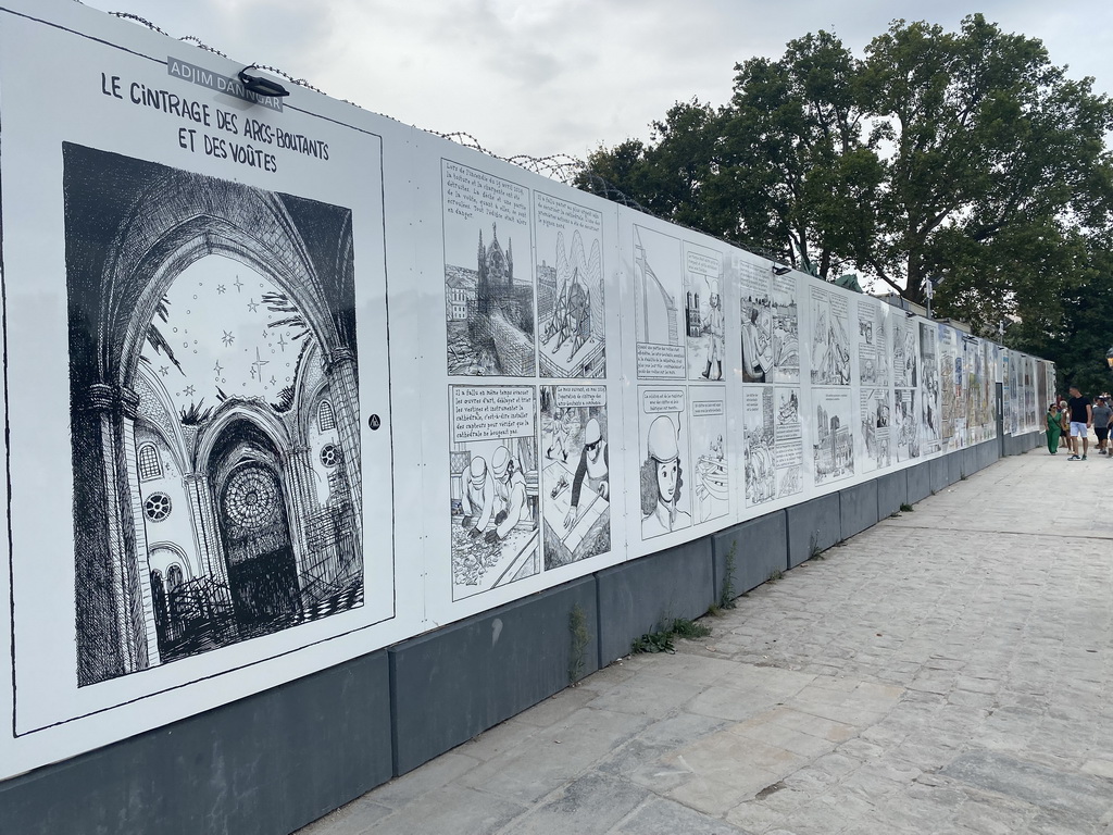 Drawings by Adjim Danngar at the exhibition `Le chantier de sécurisation de Notre-Dame de Paris` at the Parvis Notre Dame - Place Jean-Paul II square