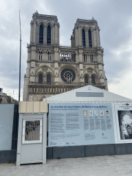 Front of the Cathedral Notre Dame de Paris, under renovation, and information on the exhibition `Le chantier de sécurisation de Notre-Dame de Paris` at the Parvis Notre Dame - Place Jean-Paul II square