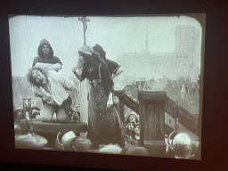 Screen with a scene from the movie `Notre-Dame de Paris` from 1911 at the Archaeological Crypt of the Île de la Cité