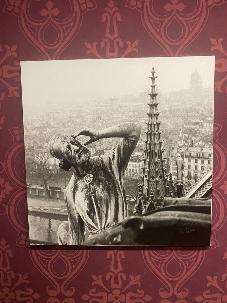 Old photograph of a statue of evangelist Thomas and the spire of the Cathedral Notre Dame de Paris at the Archaeological Crypt of the Île de la Cité