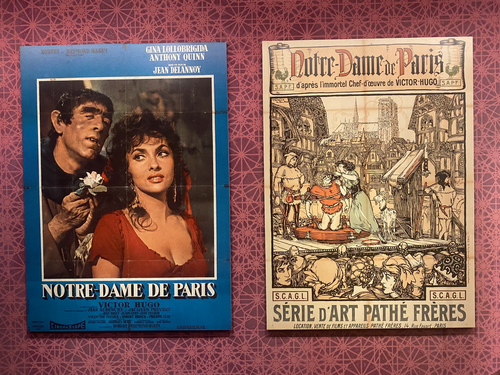 Old movie posters for `Notre-Dame de Paris` films at the Archaeological Crypt of the Île de la Cité