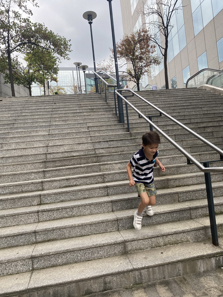 Max on the staircase next to the Pullman Paris La Défense hotel