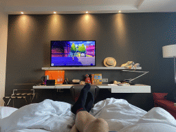 Tim playing `Pokémon Shield` on the Nintendo Switch in our room at the Pullman Paris La Défense hotel