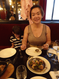 Miaomiao eating snails at the L`Escargot Montorgueil restaurant
