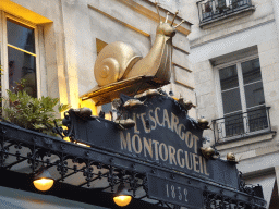 Snail statue in front of the L`Escargot Montorgueil restaurant at the Rue Montorgueil street