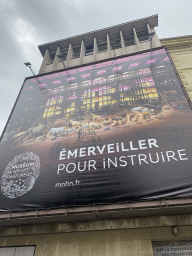Poster at the southwest side of the Grande Galerie de l`Évolution museum at the Allée Haüy street