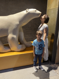 Miaomiao and Max with a Polar Bear statue at the ground floor of the Grande Galerie de l`Évolution museum