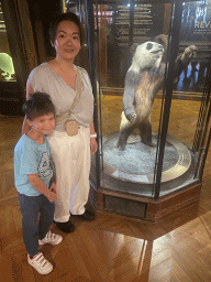 Miaomiao and Max with a stuffed Giant Panda at the second floor of the Grande Galerie de l`Évolution museum