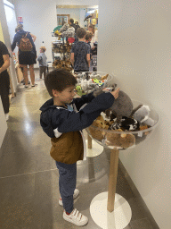 Max with plush animals at the shop at the ground floor of the Grande Galerie de l`Évolution museum