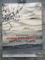 Poster of the exhibition `Hymne à la Beauté` by Matthieu Ricard at the top floor of the Grande Arche de la Défense building