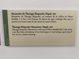 Explanation on the photograph of the Thrangu Rinpoche Monastery in Nepal at the exhibition `Hymne à la Beauté` at the top floor of the Grande Arche de la Défense building