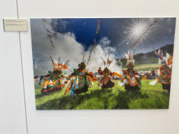 Photograph of the Danced Epic of King Gesar at the exhibition `Hymne à la Beauté` at the top floor of the Grande Arche de la Défense building, with explanation