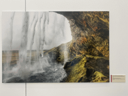 Photograph of the Seljalandsfoss waterfall at the exhibition `Hymne à la Beauté` at the top floor of the Grande Arche de la Défense building, with explanation