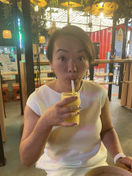 Miaomiao having a drink at  the Monkey Market restaurant at the Third Floor of the Westfield Les 4 Temps shopping mall