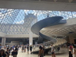 Staircase from the lobby at the Lower Ground Floor of the Louvre Museum to the Louvre Pyramid at the Cour Napoleon courtyard, with a view on the Denon Wing