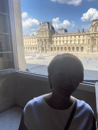 Miaomiao at the First Floor of the Denon Wing of the Louvre Museum, with a view on the Cour Napoleon courtyard with the Louvre Pyramid and the Richelieu Wing